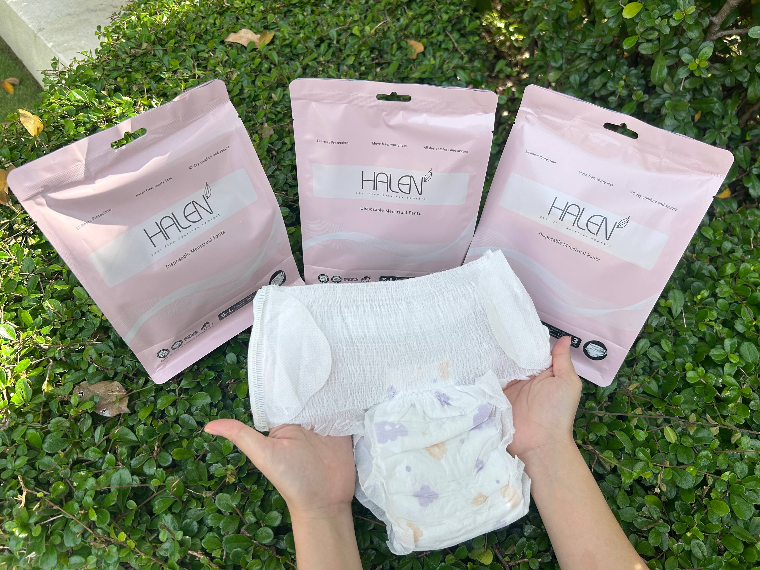 HALEN Product Packages and Menstrual Pants on Grass
